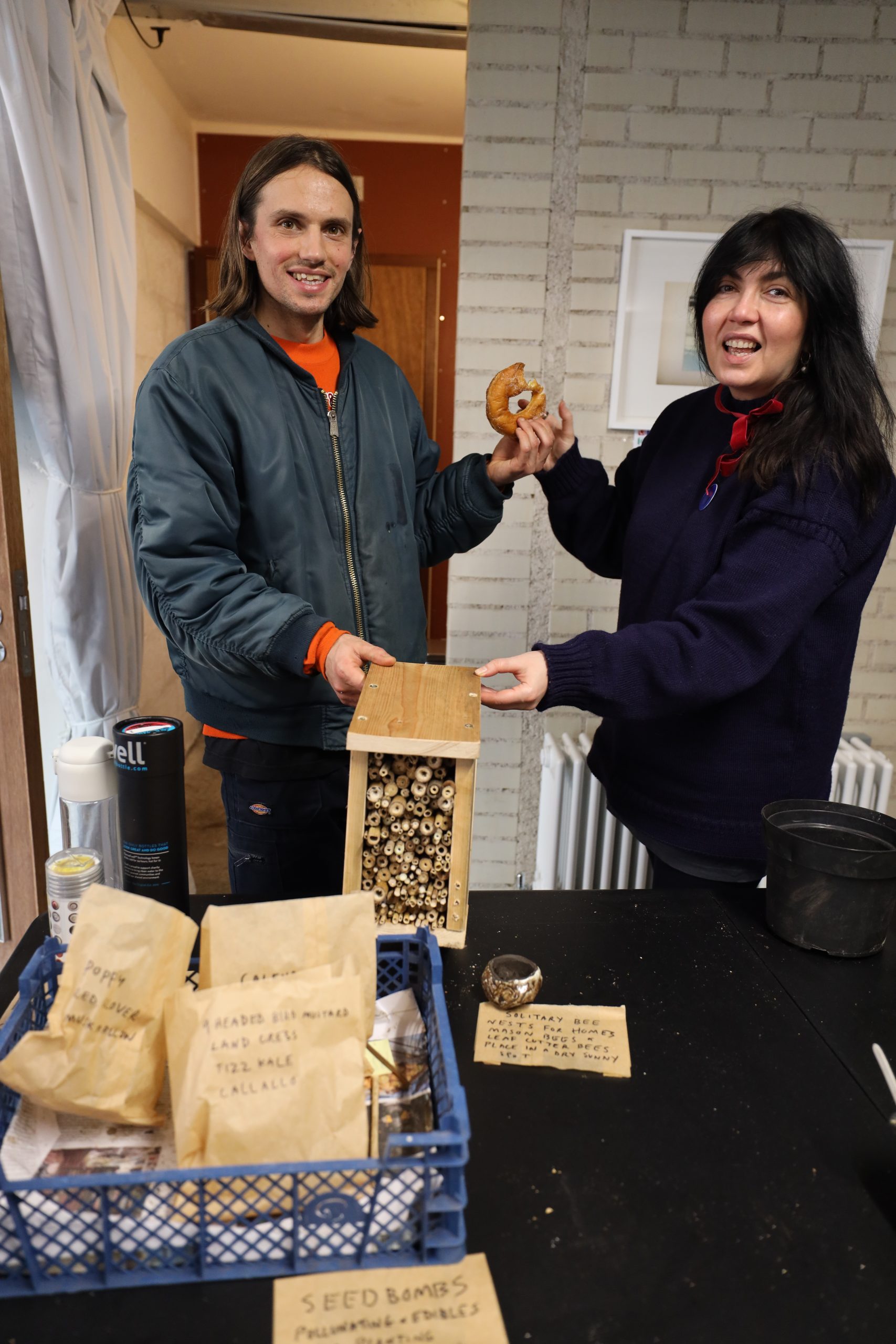 Jack Jeans posing with an insect home and Columbian sweet 