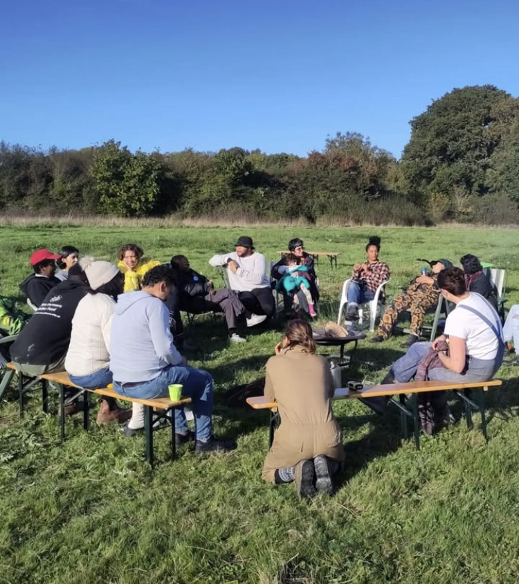 A circle gathering in the open air